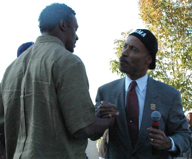 Cuyahoga County Commissioner Peter Lawson Jones greeting Browns Pro Bowl Linebacker Willie McGinest at Russell Simmons Vote Rally